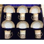 An Edwardian Royal Worcester pale blue and gilt decorated set of six coffee cans and saucers date