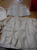 A box containing various 19th Century and later lace decorated clothing, underclothing,