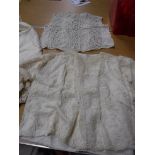 A box containing various 19th Century and later lace decorated clothing, underclothing,
