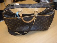 A Louis Vuitton carry all bag with shoulder strap and carry handles numbered to the interior VI0967