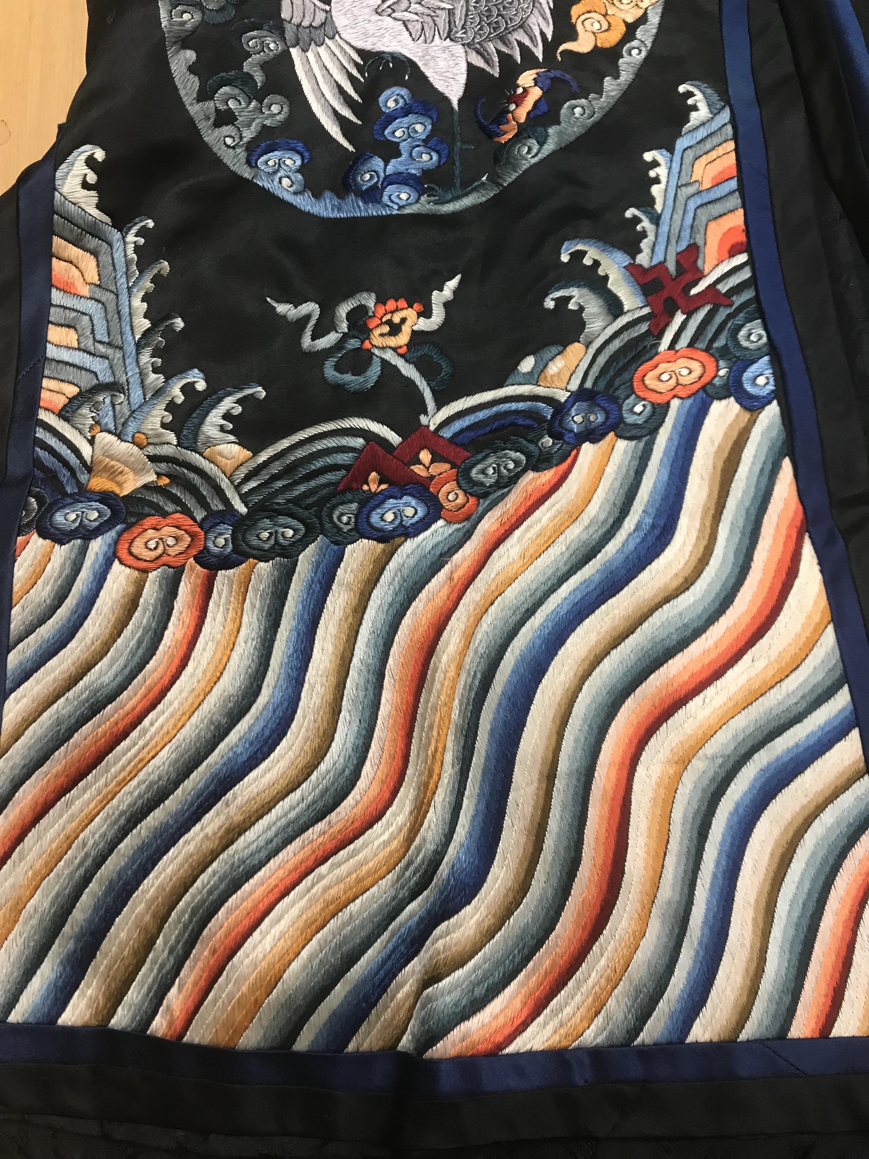 A Chinese silk jacket with crane and wave decoration on a black ground - Image 2 of 8