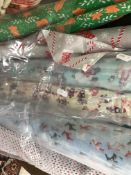 Seven part and full rolls of Christmas themed polycotton fabric together with sewing panel kits