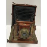 A circa 1900 Thornton Pickard mahogany and brass cased bellows camera 23 cm high x 21 cm wide