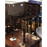 A Victorian mahogany drop-leaf work table with two drawers as three to front,