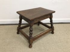 A 19th Century oak stool, the oval top with moulded edge above a plain frieze,