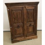 A 20th Century Indian teak cupboard in the 17th Century manner,