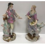 A pair of 19th Century Meissen figures in 18th Century dress,