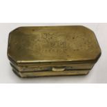 A 19th Century Dutch brass tobacco box of elongated octagonal form,