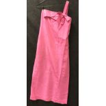 A pink silk type strapless gown with boned bodice and cross over front,