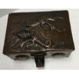 A Newlyn School copper box by John Pearson, the top embossed with two wyvern,