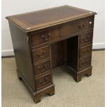 A mahogany kneehole desk in the Georgian style,