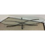 A bronze 'Spider' coffee table with oval glass top designed by Michel Mangematin and Roger Bruny,