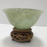 A mutton fat jade bowl of simple flared form, raised on a circular foot, 10 cm diameter x 4.
