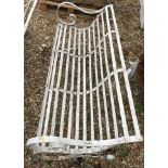A Victorian wrought iron slatted garden bench seat, together with another as a pair,