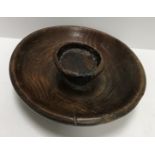 An 18th Century treen ware bowl with interior raised section (possibly a nut bowl),