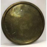 An engraved brass circular Benares type table top, 69.