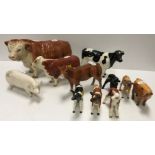 A collection of various cow figures including a Coopercraft Hereford bull (A477) 25 cm long x 14 cm