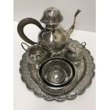 A Middle Eastern white metal coffee set on tray comprising coffee pot,