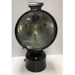 A vintage Tilley floodlight projector lamp, black enameled and converted to electricity,