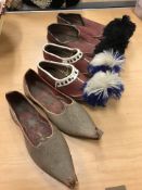 A quantity of Middle Eastern style leather shoes, hats,