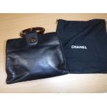 A Chanel black leather handbag with tortoiseshell style hoop handles and CC monogram No'd 5497011