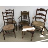 A stained beech rush seat ladder back elbow chair, two standard rush seat ladder back chairs,