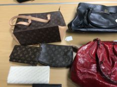 A collection of handbags to include a blue Tods bag, a further bag stamped "Louis Vuitton",