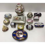 A collection of twelve various Limoges and other porcelain lidded boxes including a rectangular