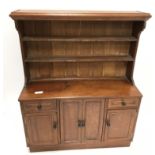 An Arts & Crafts miniature walnut dresser by D Rolyat of Battersea,