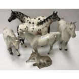 Two Beswick Appaloosa stallion figures with slightly differing markings 20 cm high together with