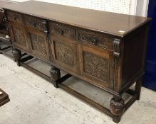 A Maple & Co oak dining room suite comprising carved oak drawer leaf table in the 17th Century