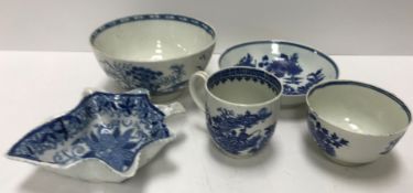 An 18th Century Worcester blue and white "Fisherman with fish and cormorant" pattern tea cup on a