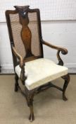 An early 20th Century walnut framed carver chair and standard dining chair in the 18th Century