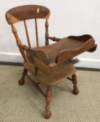 A late 20th Century yew wood and elm child's chair with tray and interchangeable extra feet 40 cm