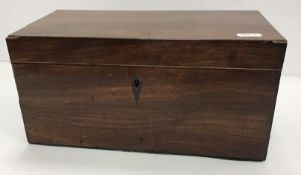 A 19th Century mahogany tea caddy of plain rectangular form, rosewood strung,