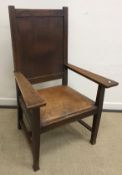 An oak framed carver chair in the style of Gordon Russell,