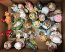 A collection of twenty-four various Beswick and Royal Albert Beatrix Potter figures including "Mrs