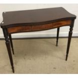 A modern mahogany serpentine fronted fold over tea table in the Regency style,
