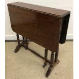 A Victorian mahogany drop leaf Sutherland table, three 20th Century wine tables,