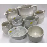 A collection of six various white glazed pottery jugs including Burleigh ironstone, hooped jugs,