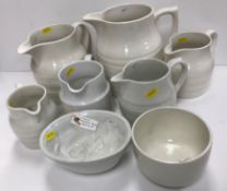 A collection of six various white glazed pottery jugs including Burleigh ironstone, hooped jugs,