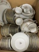 A Noritake "Memory" floral patterned and gilt lined 90 piece dinner service and a mirror