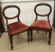 A set of four Victorian mahogany balloon back dining chairs with upholstered drop in seats on