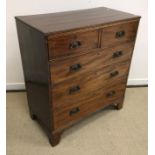 A Victorian mahogany square fronted chest of two short over three long drawers raised on bracket