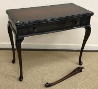 A modern mahogany fold over card table in the Georgian style,