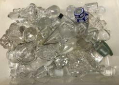 A collection of thirty-two various glass decanter stoppers,