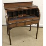 An Edwardian mahogany and inlaid cylinder top bureau opening to reveal a basic fitted interior with