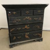 An 18th Century black lacquered and Japanned chest, the later top over a moulded cushion drawer,