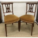 A set of four Edwardian mahogany and inlaid salon chairs with gold upholstered seats on sabre