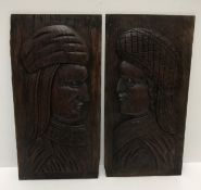 A pair of 19th Century carved oak panels as be-hatted figures in the 17th Century Flemish style 35